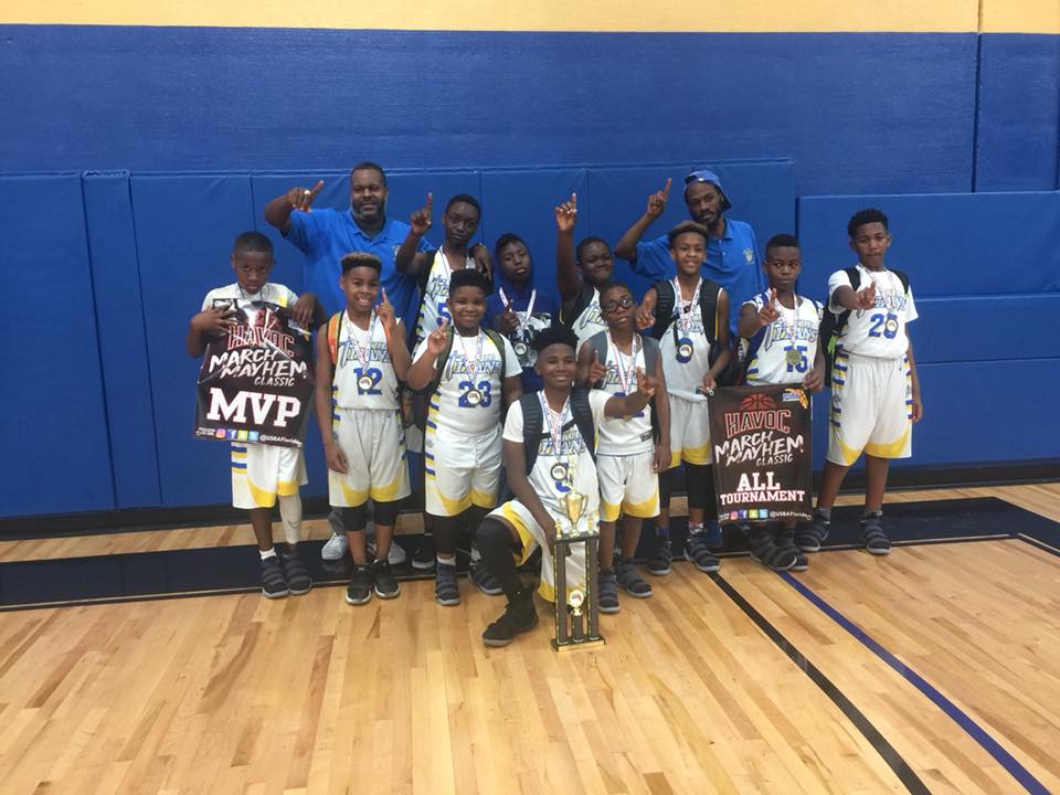 Titans basketball players with trophy